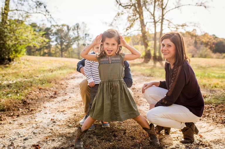 little girl being silly during her family photo session