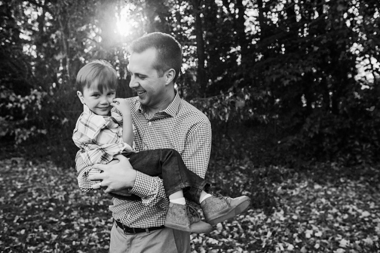 black and white, natural light outdoor family portrait of father and son