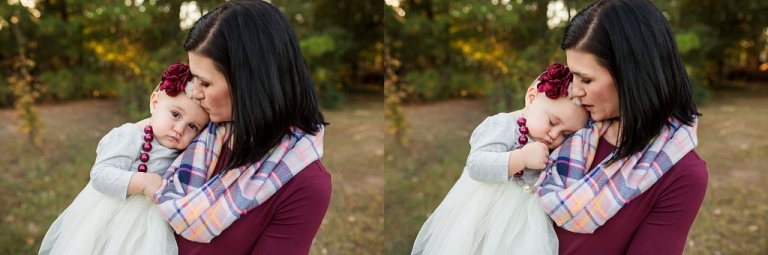 mommy snuggling baby in her arms