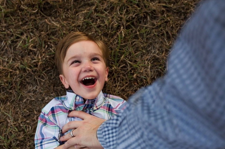 little boy being tickled