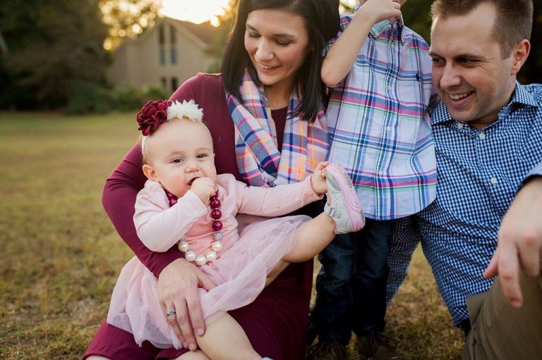 Little girl sucking on a sucker