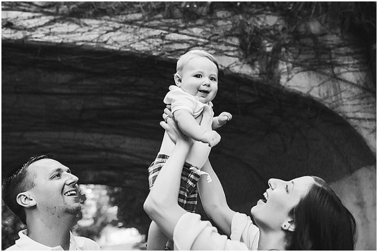 little boy being lifted in the air