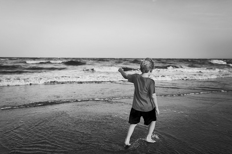Wild Dunes-Isle of Palms Little boy walking on the edge of the water