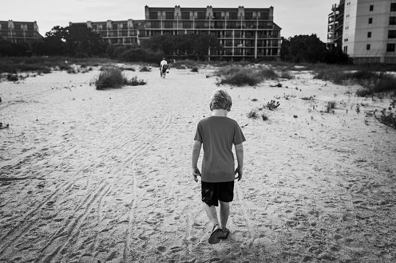 Wild Dunes-Isle of Palms little boy walking in the sand back to his condo