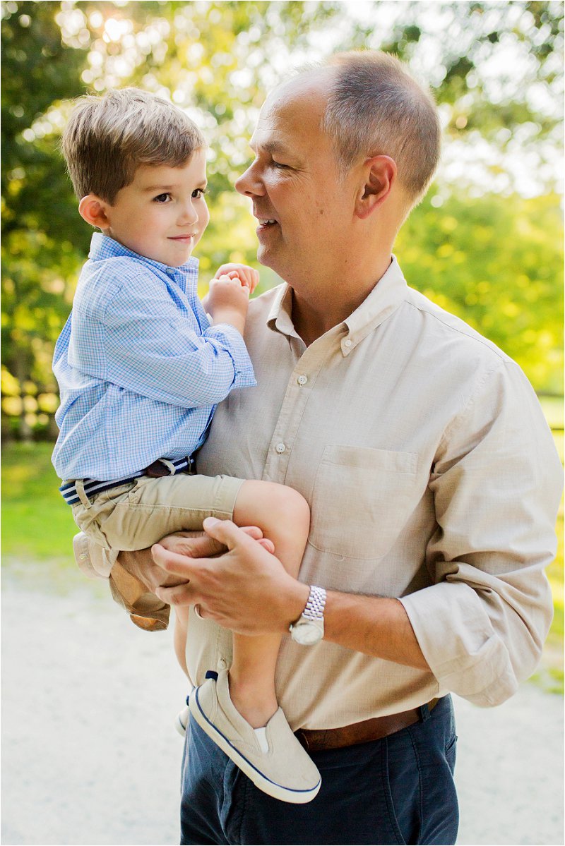 dad holding son