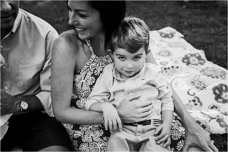 little boy sitting on mom's lap for photos