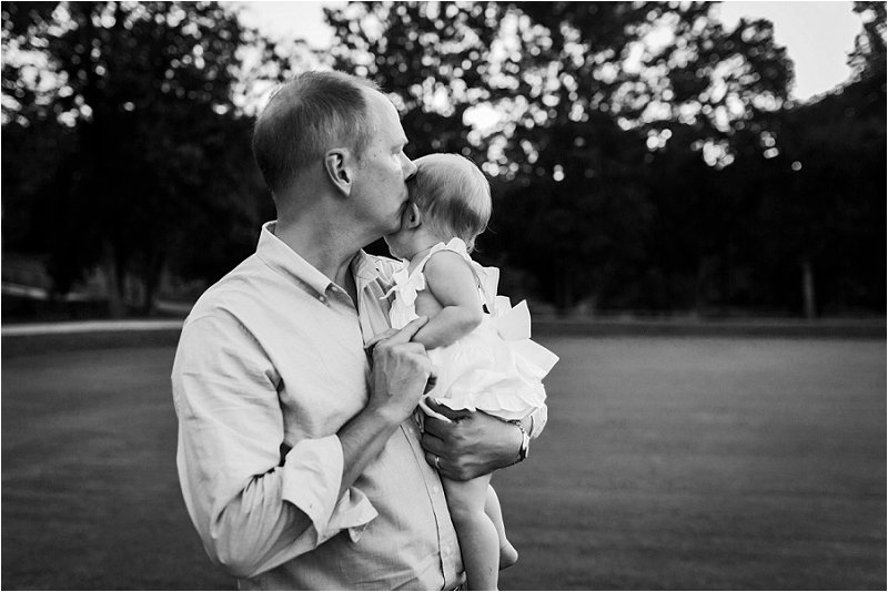 dad kissing baby girl