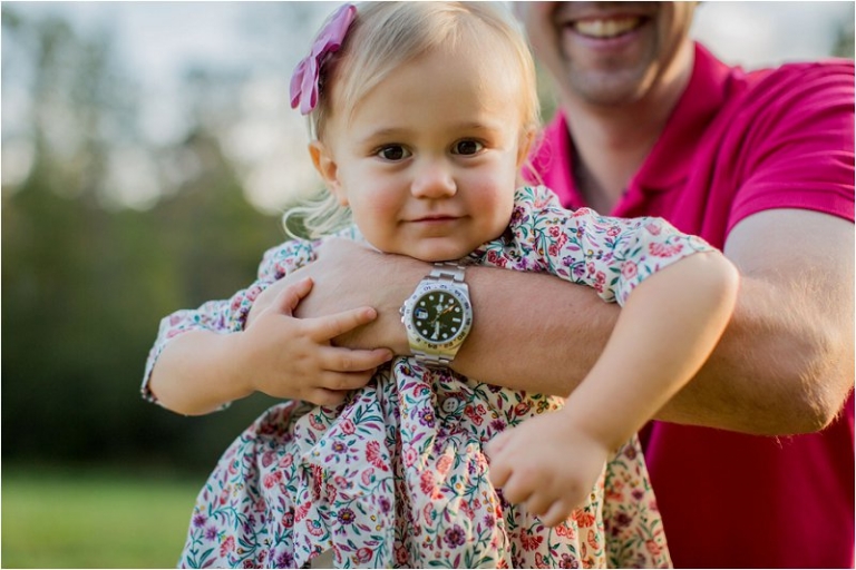 daddy holding daughter