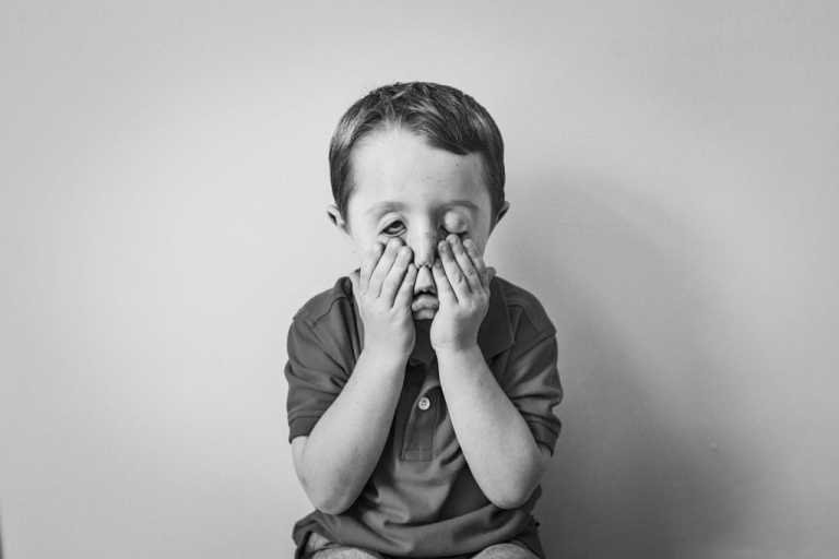 black and white photo series of the faces of childhood