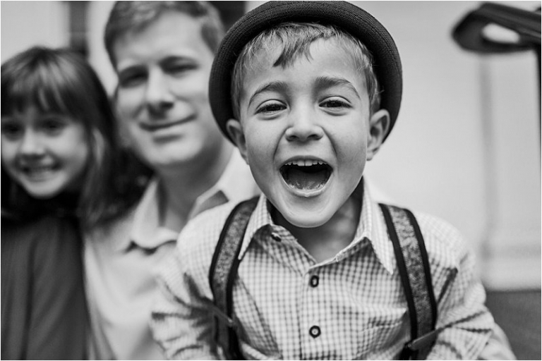 smiling boy in black and white photo