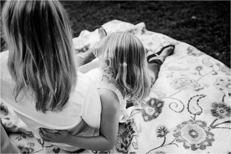 black and white photo of mommy and daughter quiet moment