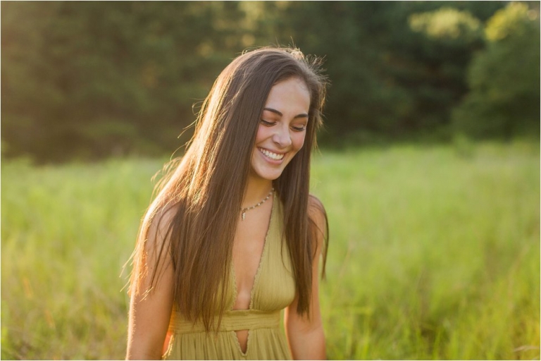 High School senior posing in tall grass