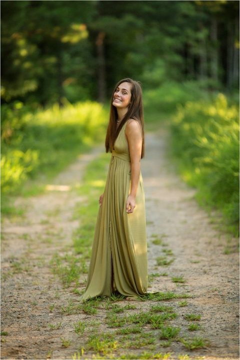 High school senior posing in green dress