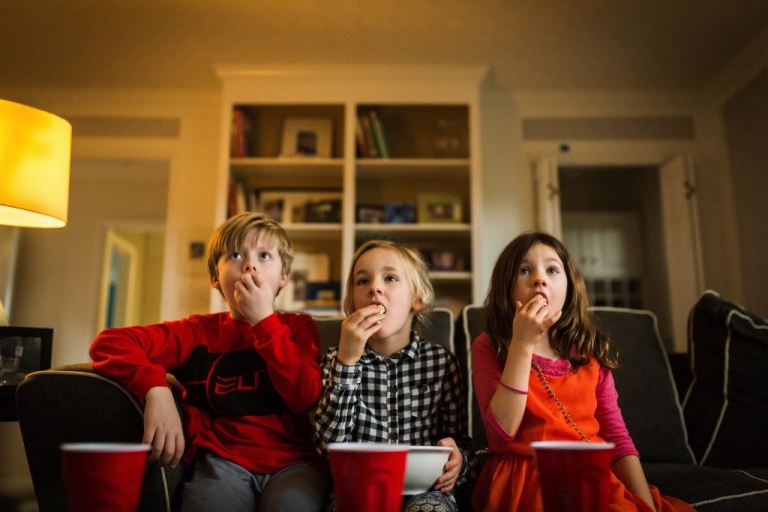 three best friends eating popcorn and watching harry potter