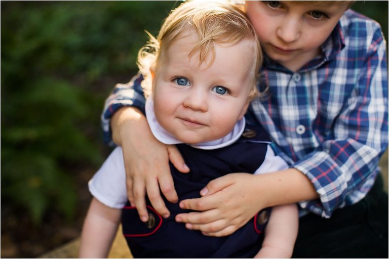 brothers hugging in the sunset
