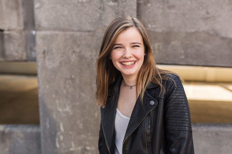 Senior photo session of beautiful girl in a parking garage in Buckhead