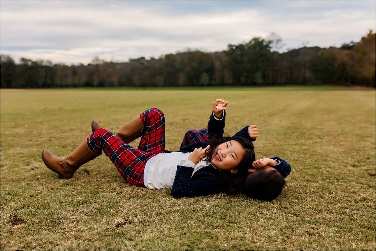 A brother and sister rolling on the polo fields in Vinings