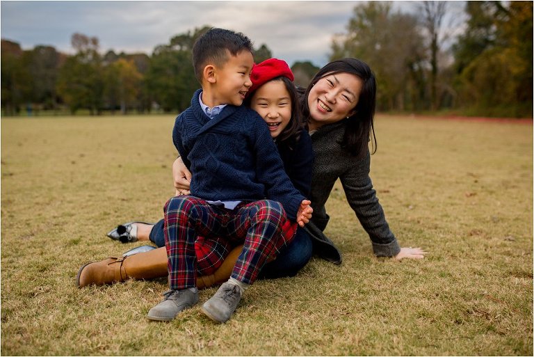 mommy and her kids sitting on a polo field in Vinings