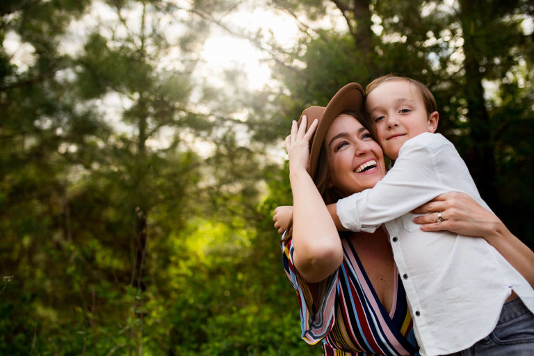 Mom hugging little boy.  