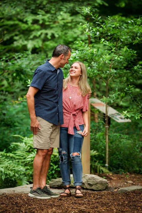 sweet moment between dad and his high school senior daughter
