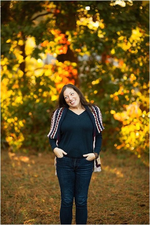 Adorable brunette woman with hands in her pockets.