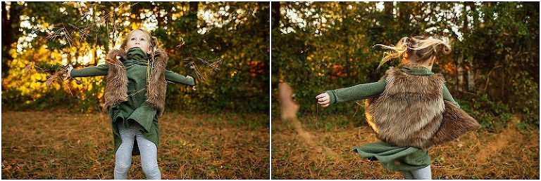 little girl tossing leaves and pine straw up in the air as she twirls around