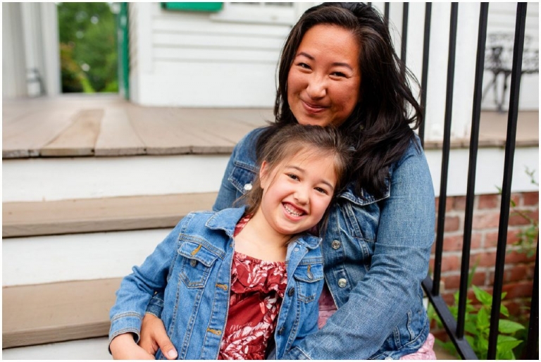 Mother and child embracing during a summer family photo session.