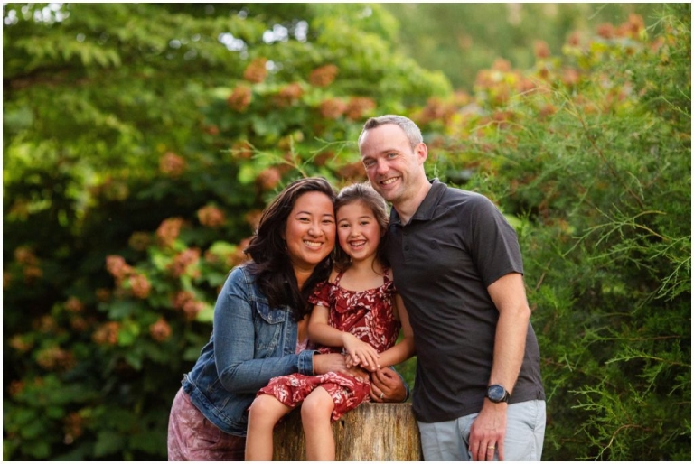 Family embracing during a summer photo session.