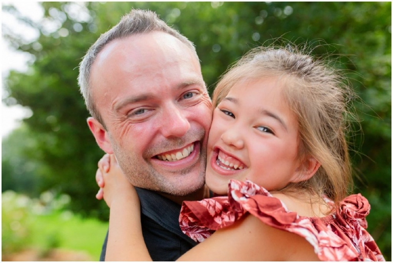 Close-up of daddy and daughter cheek to cheek